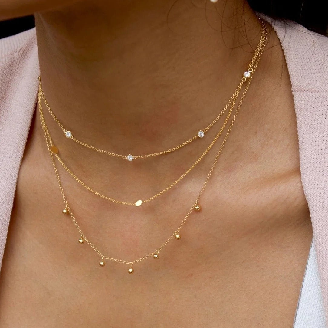 Delicate 18K gold necklace featuring light, round bead design, offering a minimalist and elegant look, perfect for adding a touch of sophistication to any outfit