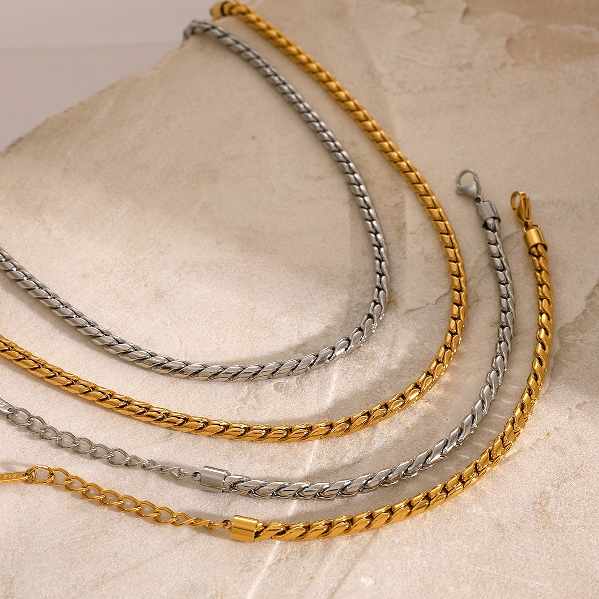 Stylish 18K gold chain bracelet and necklace set in a simple, minimalist design, offering an elegant and timeless look, perfect for everyday wear or special occasions.