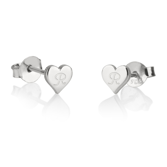 A pair of elegant heart stud earrings, featuring a simple yet stylish heart-shaped design. These dainty earrings are crafted with a smooth, polished finish, making them perfect for everyday wear or special occasions. Their minimalist style adds a subtle touch of romance and charm to any outfit, making them a versatile accessory for any jewelry collection. Ideal as a thoughtful gift or a timeless personal piece