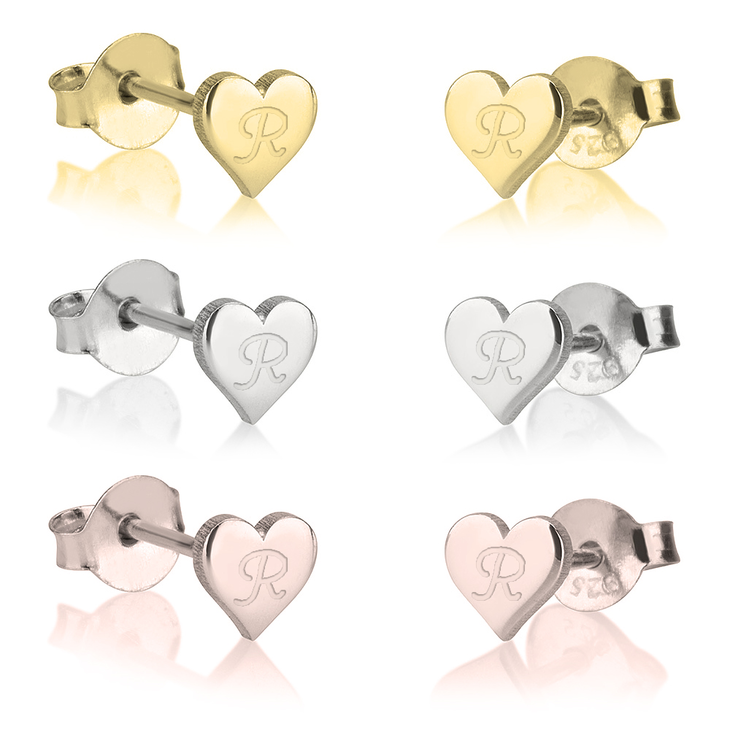 A pair of elegant heart stud earrings, featuring a simple yet stylish heart-shaped design. These dainty earrings are crafted with a smooth, polished finish, making them perfect for everyday wear or special occasions. Their minimalist style adds a subtle touch of romance and charm to any outfit, making them a versatile accessory for any jewelry collection. Ideal as a thoughtful gift or a timeless personal piece