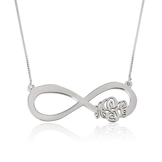 A sleek infinity monogram necklace featuring a delicate infinity symbol intertwined with personalized initials. The elegant design combines the timeless infinity shape with custom lettering, creating a stylish and meaningful accessory. Crafted with a polished finish, this necklace is perfect for daily wear or special occasions, symbolizing eternal connection and personal expression. Ideal as a thoughtful gift or a unique addition to any jewelry collection