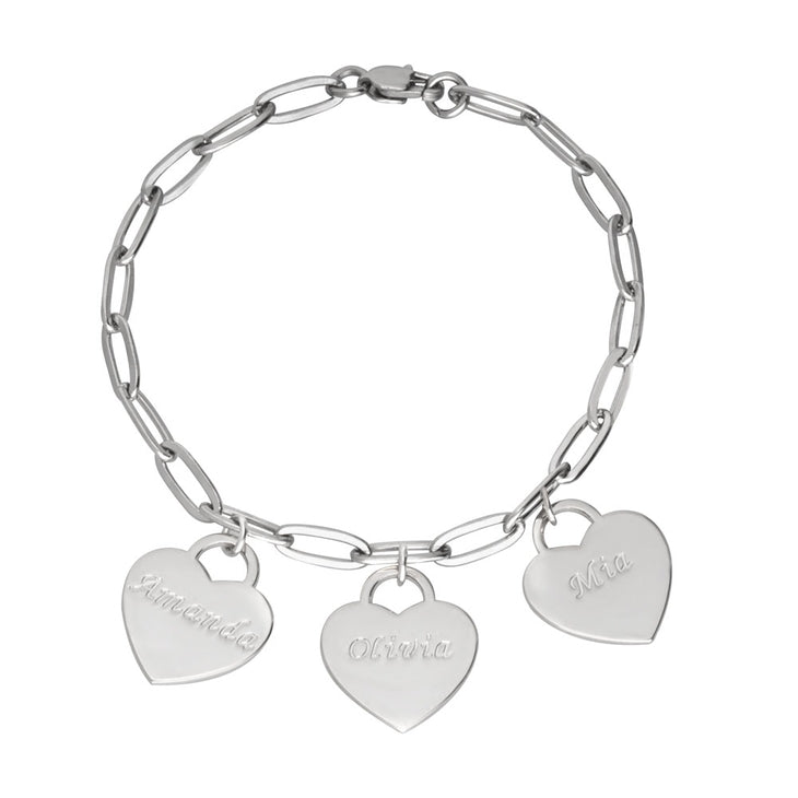 A sleek and elegant custom paperclip bracelet with delicate heart charms. The bracelet features modern, elongated links with small, polished heart-shaped pendants hanging between them, creating a balance of minimalist design and sentimental charm. The piece exudes a stylish, contemporary look, perfect for layering or wearing solo as a subtle statement accessory. Ideal for everyday wear or as a personalized gift.